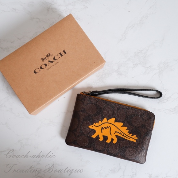 Coach Handbags - NWT Coach Corner Zip Wristlet with Dinosaur Motif